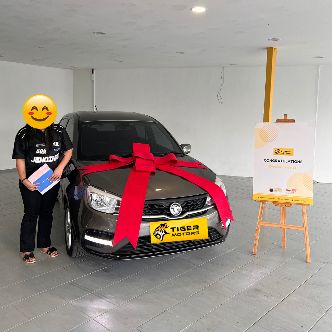 Customer collecting their 2022 Proton Saga from Tiger Motors in Kuching, Sarawak